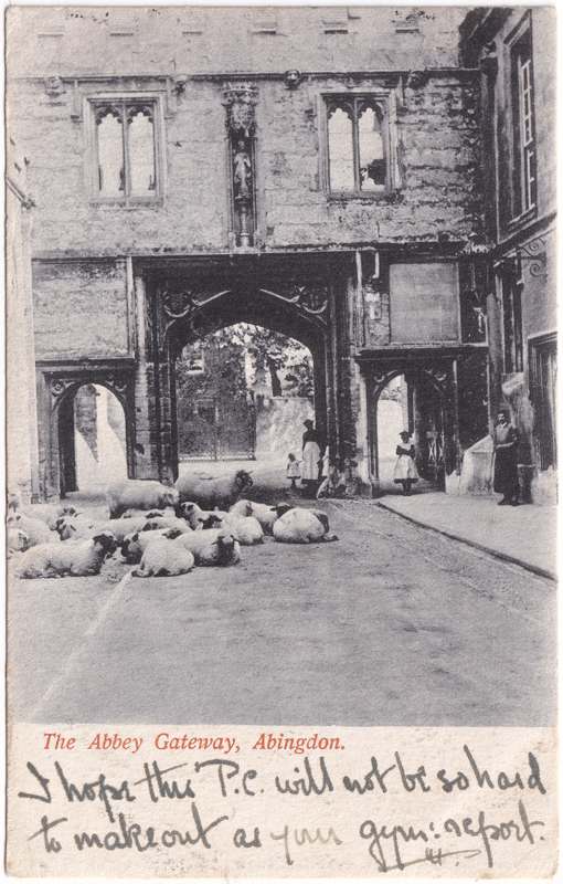 The front of an old postcard. The postcard is of Abingdon: Abbey Gateway