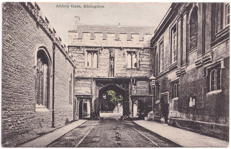 The front of an old postcard. The postcard is of Abingdon: Abbey Gateway