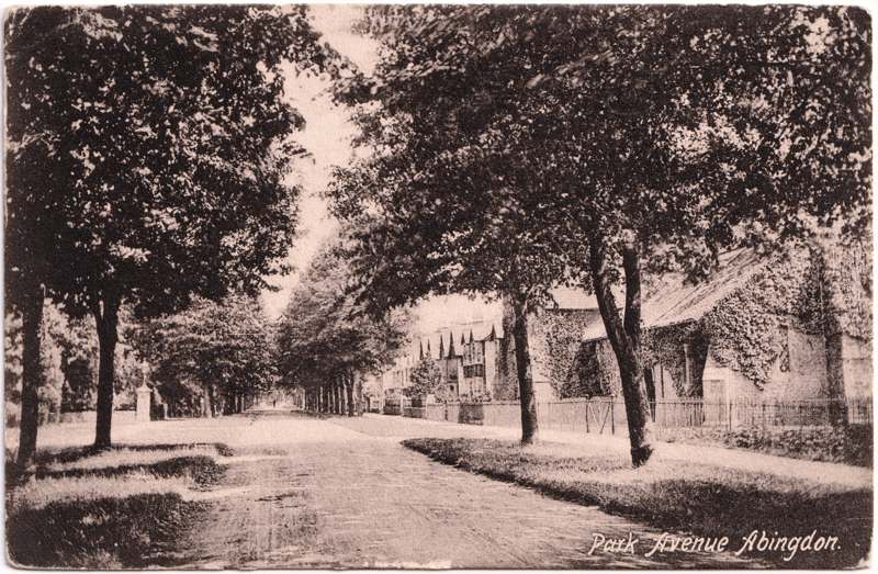 The front of an old postcard. The postcard is of Abingdon: Albert Park and Abingdon School