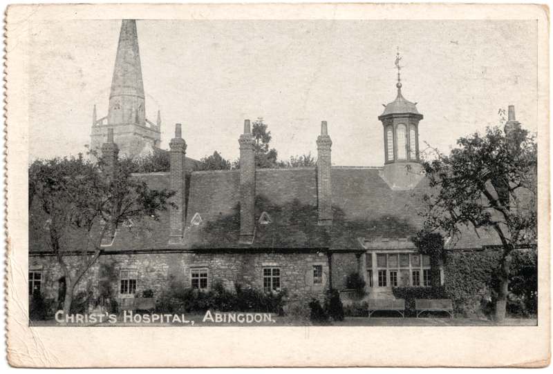The front of an old postcard. The postcard is of Abingdon: Almshouses