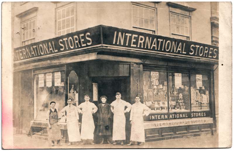 The front of an old postcard. The postcard is of Abingdon: Marketplace