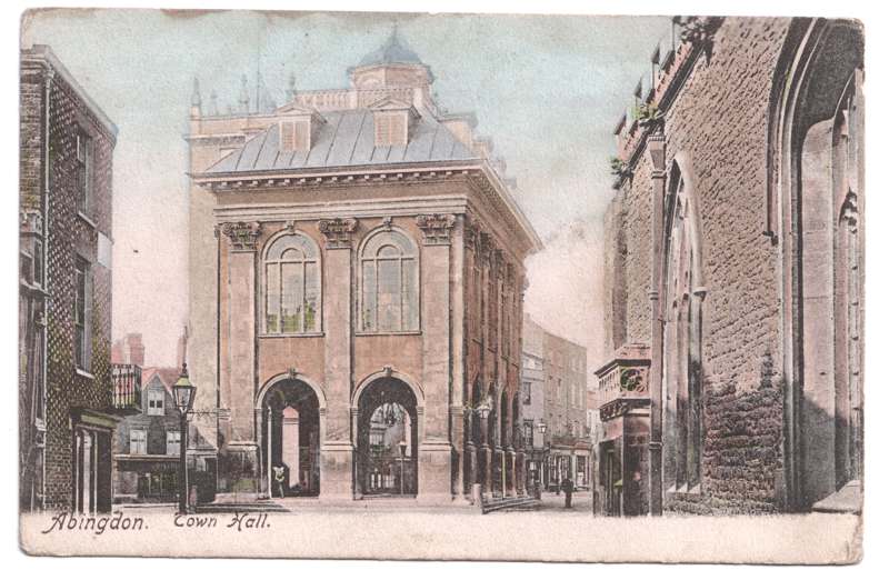 The front of an old postcard. The postcard is of Abingdon: Marketplace