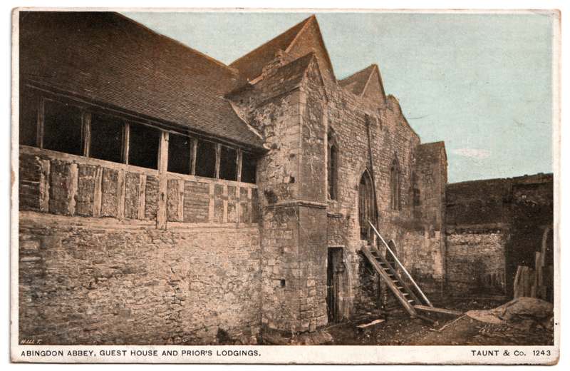 The front of an old postcard. The postcard is of Abingdon: The Abbey Buildings