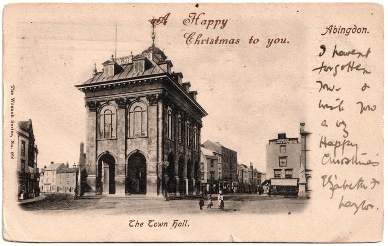 The front of an old postcard. The postcard is of Abingdon: Marketplace