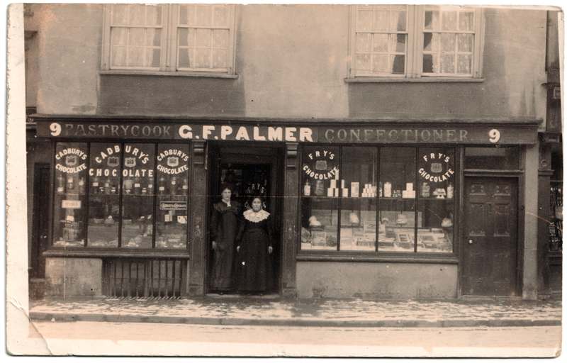 The front of an old postcard. The postcard is of Abingdon: Marketplace