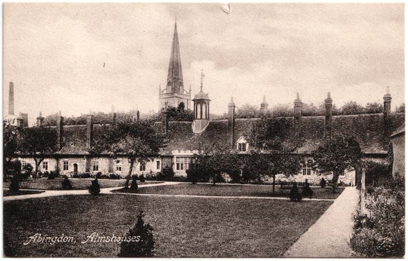 The front of an old postcard. The postcard is of Abingdon: Almshouses