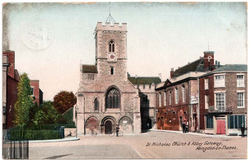 The front of an old postcard. The postcard is of Abingdon: Abbey Gateway