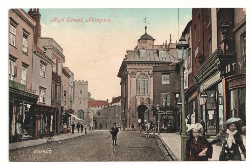 The front of an old postcard. The postcard is of Abingdon: Town Centre Streets
