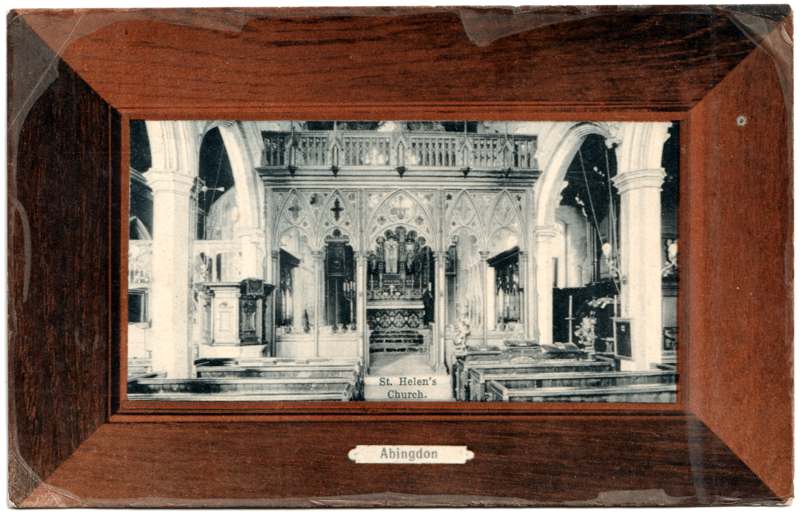 The front of an old postcard. The postcard is of Abingdon: St. Helen's Church and the Almshouses