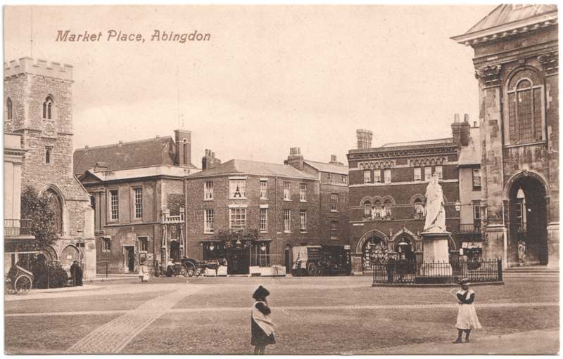The front of an old postcard. The postcard is of Abingdon: Marketplace