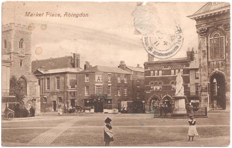 The front of an old postcard. The postcard is of Abingdon: Marketplace