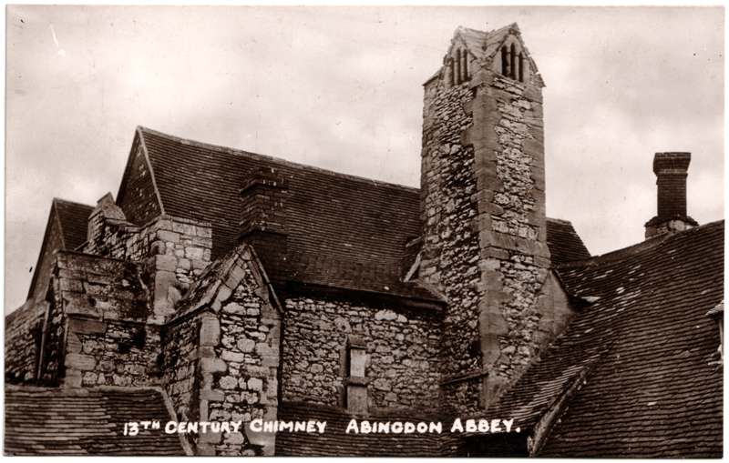 The front of an old postcard. The postcard is of Abingdon: The Abbey Buildings