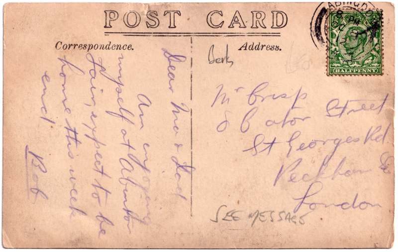 The front of an old postcard. The postcard is of Abingdon: Town Centre Streets