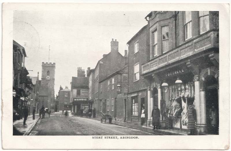 The front of an old postcard. The postcard is of Abingdon: Town Centre Streets