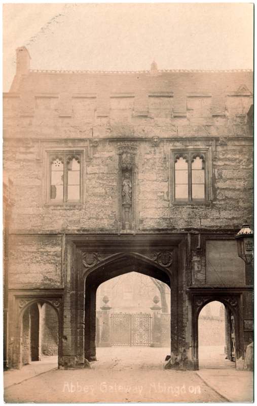 The front of an old postcard. The postcard is of Abingdon: Abbey Gateway