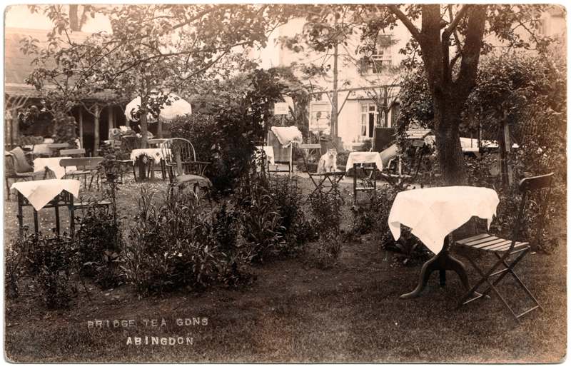 The front of an old postcard. The postcard is of Abingdon: The Bridge