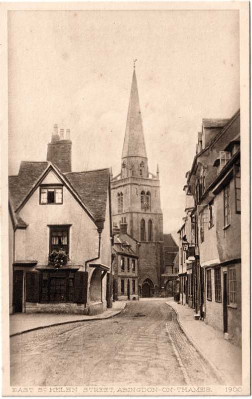 The front of an old postcard. The postcard is of Abingdon: East St Helen Street