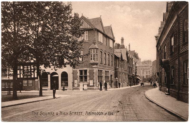 The front of an old postcard. The postcard is of Abingdon: Town Centre Streets
