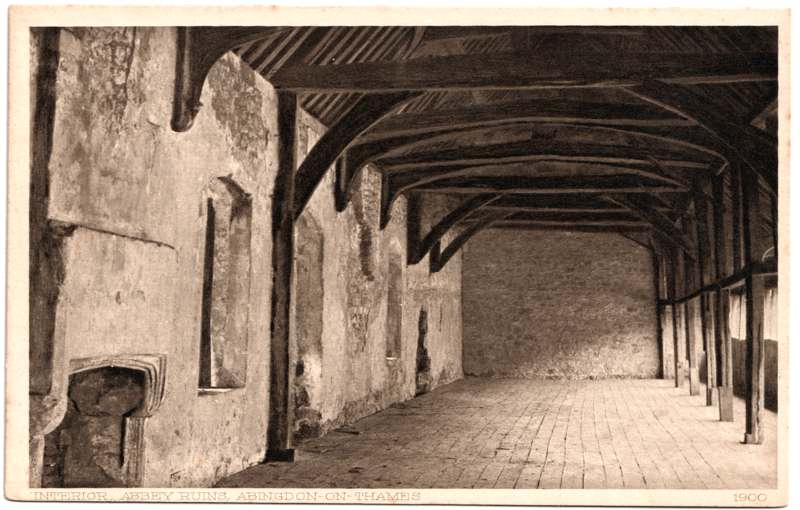 The front of an old postcard. The postcard is of Abingdon: The Abbey Buildings