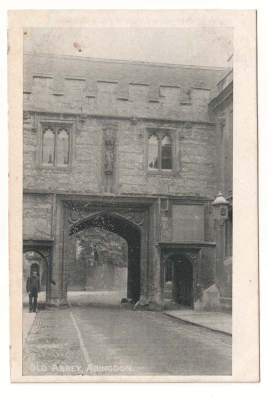 The front of an old postcard. The postcard is of Abingdon: Abbey Gateway