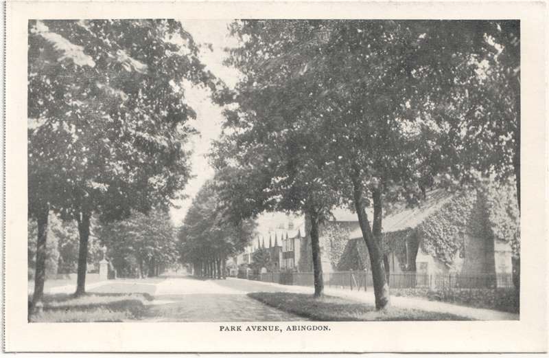The front of an old postcard. The postcard is of Abingdon: Albert Park and Abingdon School