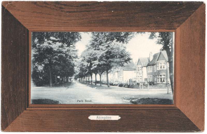 The front of an old postcard. The postcard is of Abingdon: Albert Park and Abingdon School