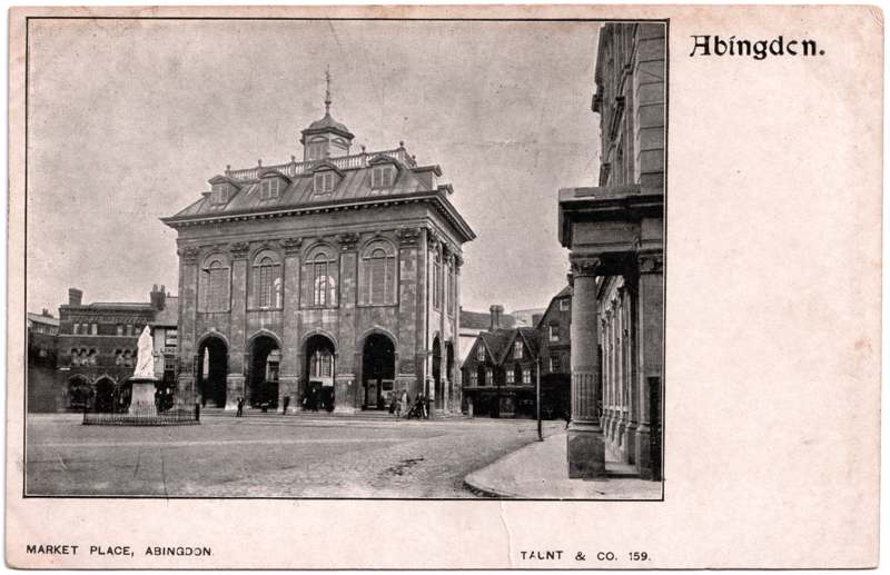 The front of an old postcard. The postcard is of Abingdon: Marketplace