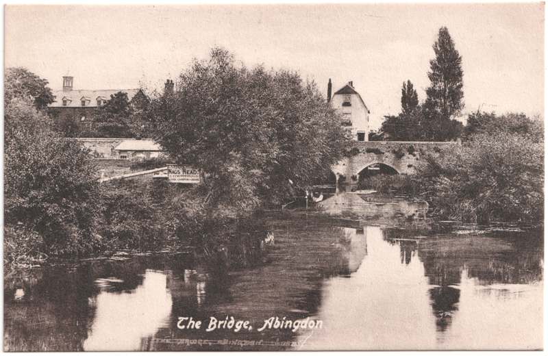 The front of an old postcard. The postcard is of Abingdon: The Bridge