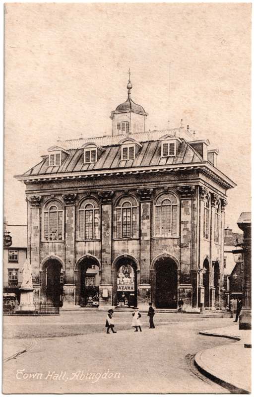 The front of an old postcard. The postcard is of Abingdon: Marketplace