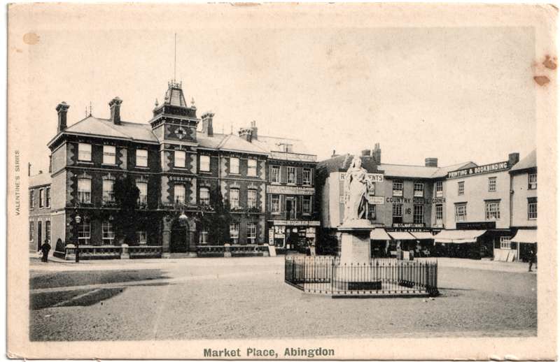 The front of an old postcard. The postcard is of Abingdon: Marketplace