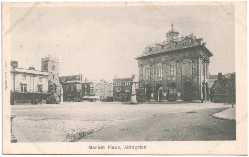 The front of an old postcard. The postcard is of Abingdon: Marketplace