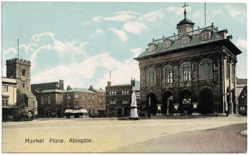The front of an old postcard. The postcard is of Abingdon: Marketplace