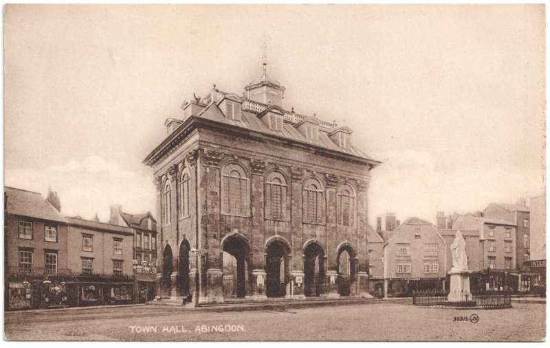 The front of an old postcard. The postcard is of Abingdon: Marketplace